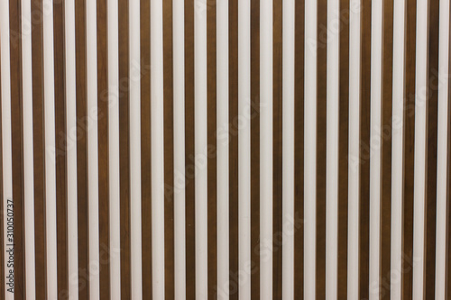 Wooden slats on floor or wall in vertical parallel pattern, background panel texture, horizontal image