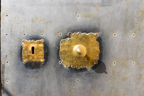 Golden iron details of an ancient door