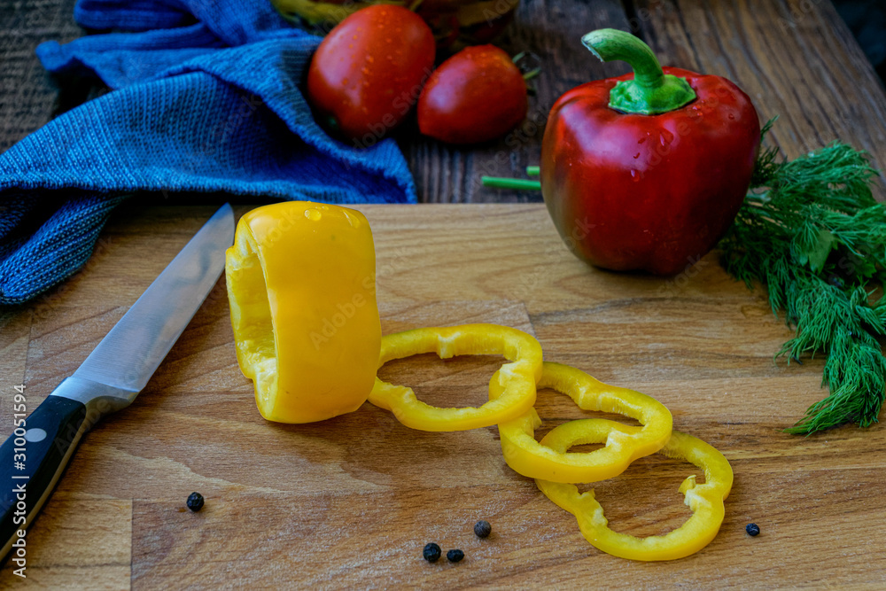 sliced bell peppers on wooden background sliced bell peppers on wooden background