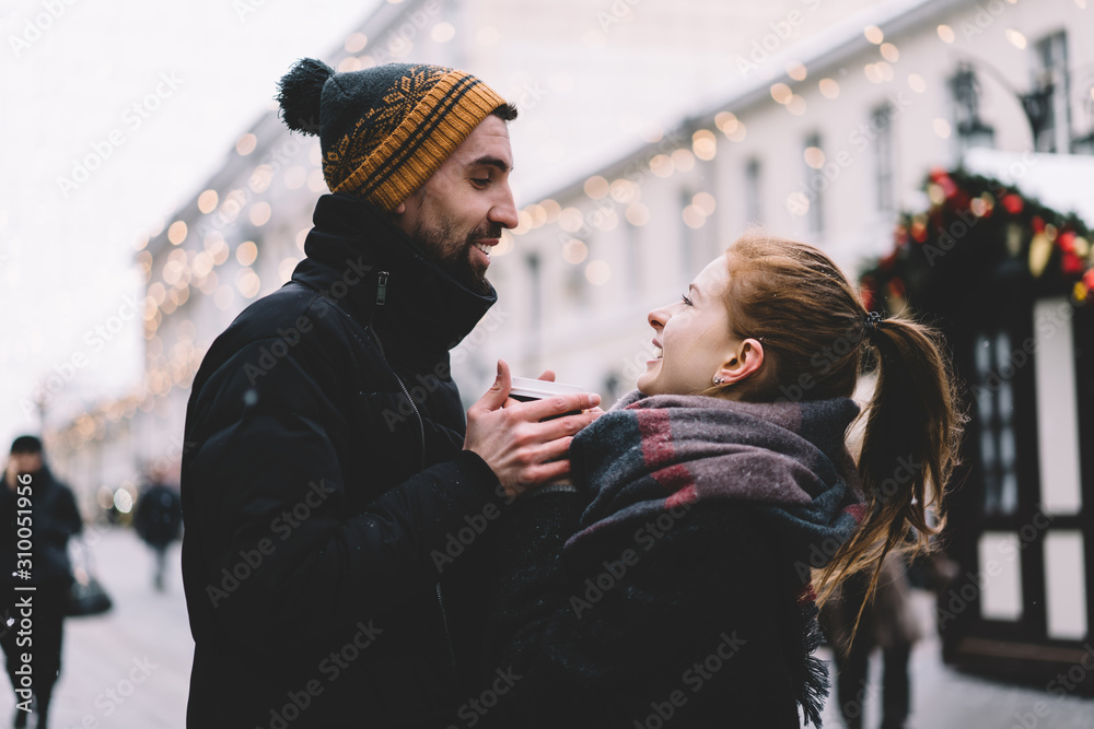 Young couple looking at each other on street