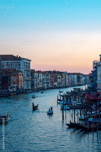 Venice, Italy - 19 July 2018: Grand Canal in Venice at the sunset, photo taken from Rialto Bridge.