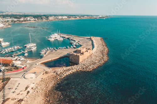 Cyprus. Pathos or Paphos. Aerial view of ancient castle or fortress - now museum and harbour with boats and yachts. beautiful mediterranean coast and blue sea, drone point of view.