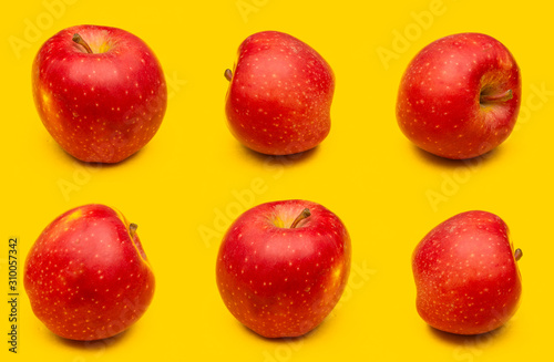 Red apple collage isolated on yellow background, fruit pattern concept