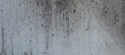 cement wall with dirt spots for background use.