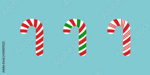 Set of candy canes in cartoon style isolated on blue background. Vector illustration of Christmas symbol