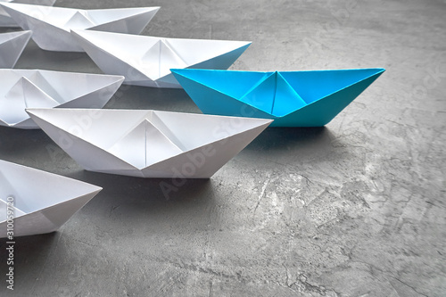 Business Concept, Paper Boat, the key opinion Leader, the concept of influence.
