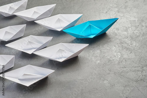 Business Concept, Paper Boat, the key opinion Leader, the concept of influence.