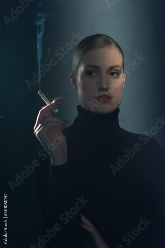 Retro 1940s woman with cigarette in black turtleneck sweater.