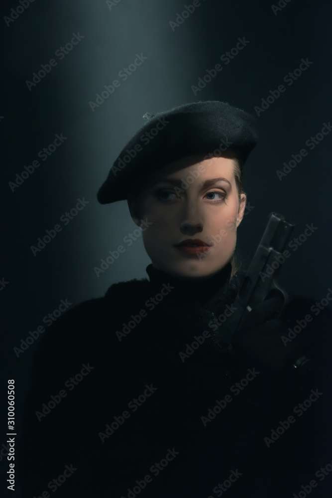 Retro 1940s woman in beret holding pistol. Retro 1940s woman in beret holding pistol.