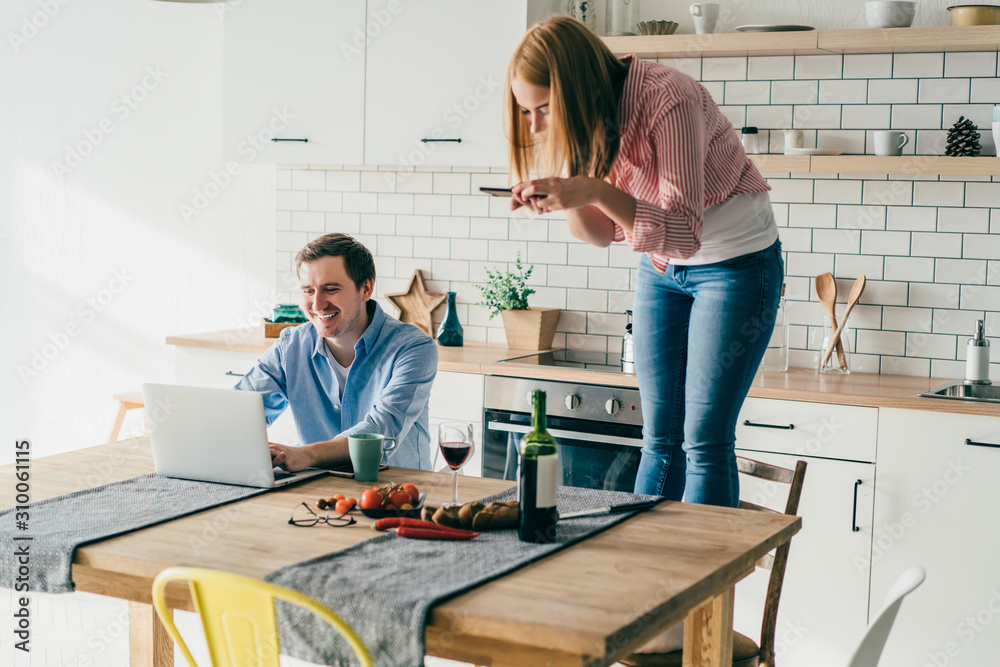 Couple chilling and having fun at kitchen