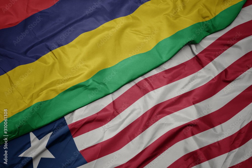 waving colorful flag of liberia and national flag of mauritius. waving colorful flag of liberia and national flag of mauritius.