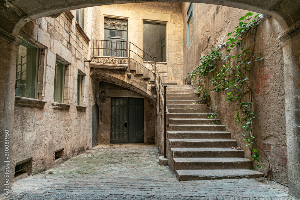 Entrance to an old house in Girona. Stairway to a still used medieval home in Northern Catalonia