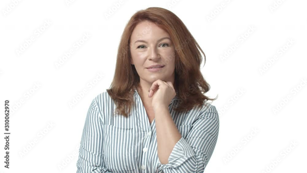 Slow-motion happy and surprised redhead adult, mature woman 50s, hear praise or compliment, look astounded, touching chest grateful, smiling with appreciation, express gratitude and satisfaction Slow-motion happy and surprised redhead adult, mature woman 50s, hear praise or compliment, look astounded, touching chest grateful, smiling with appreciation, express gratitude and satisfaction