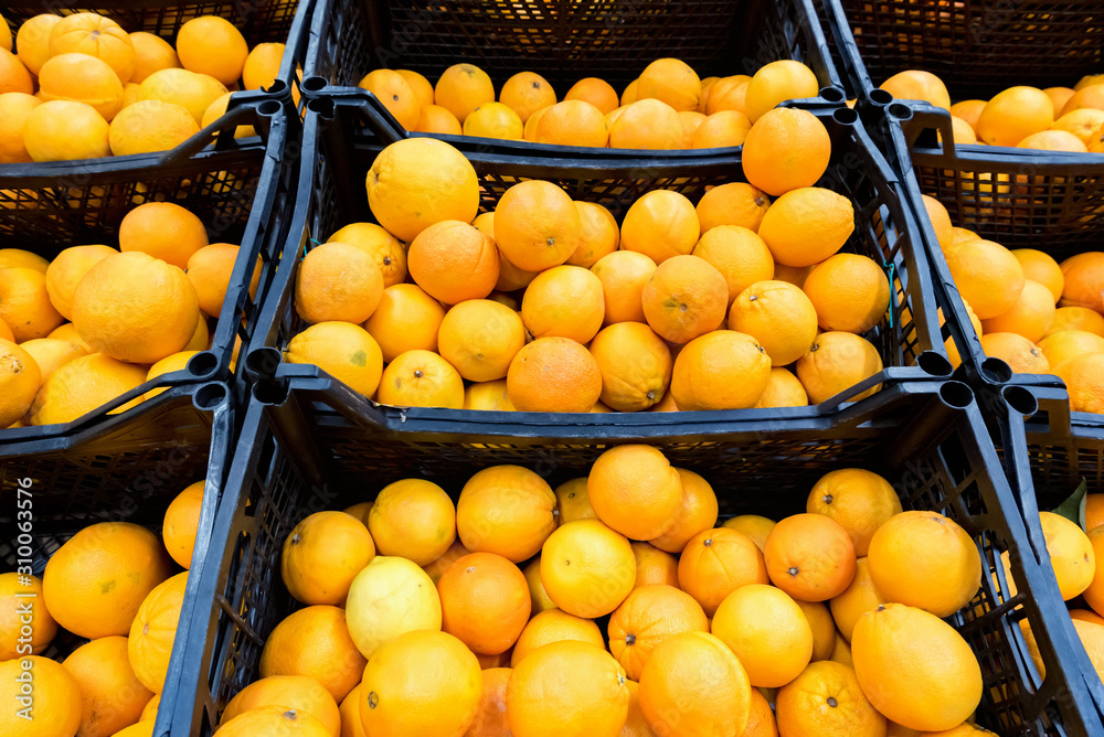 Close up ripe organic oranges for sale in supermarket