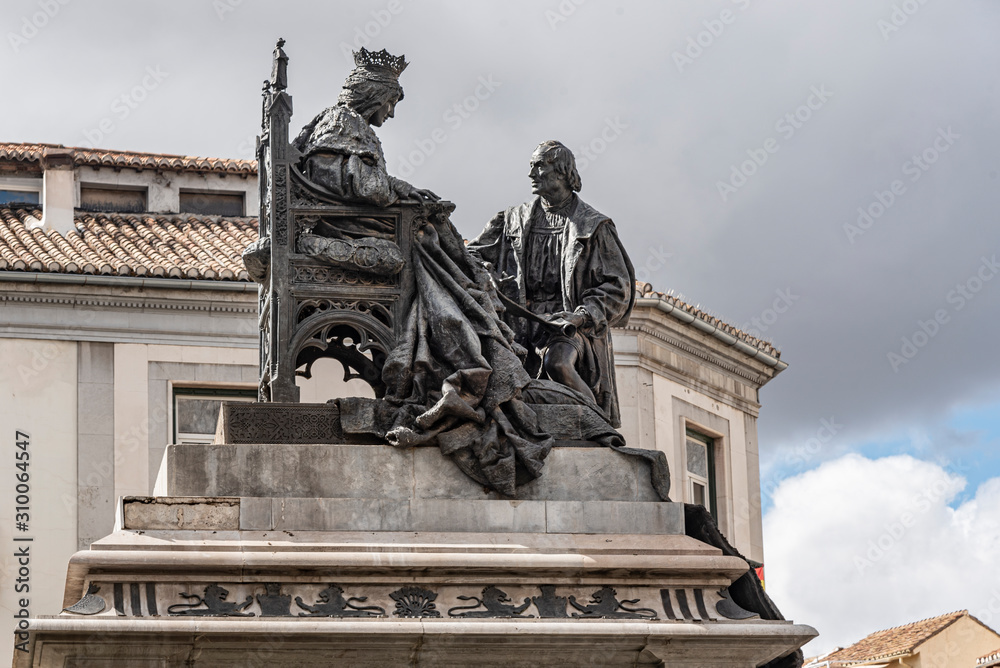 Statue of Queen Isabel with Columbus in Plaza Isabel la Catolica, Granada, Andalusia, Spain. Catholic Isabella with Columbus Statue, built in 1892