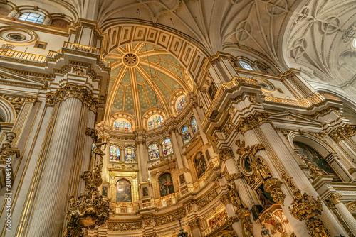 Magnificent golden dome inside the Granada Cathedral in Spain. Interior decoration found in the Granada Royal Cathedral