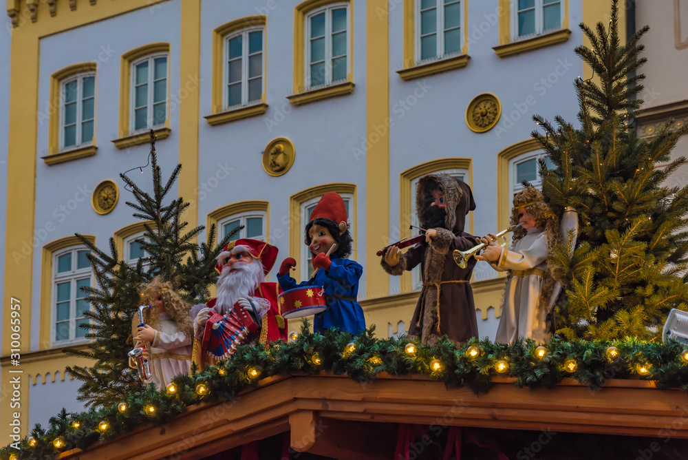 santa claus at the roof of a market stand at the christkindlmarkt in rosenheim, bavaria