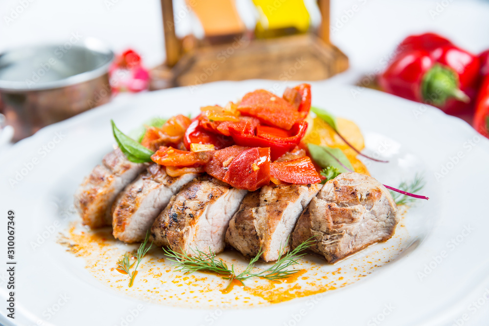 Roasted pork fillet with vegetables on a plate