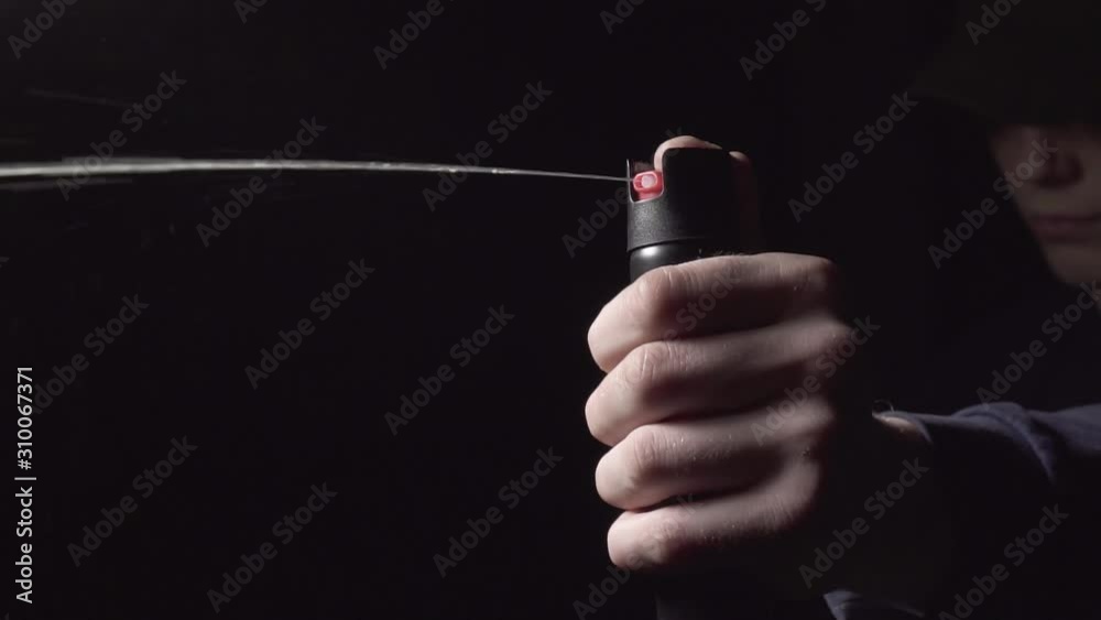 man uses pepper spray for self-defense