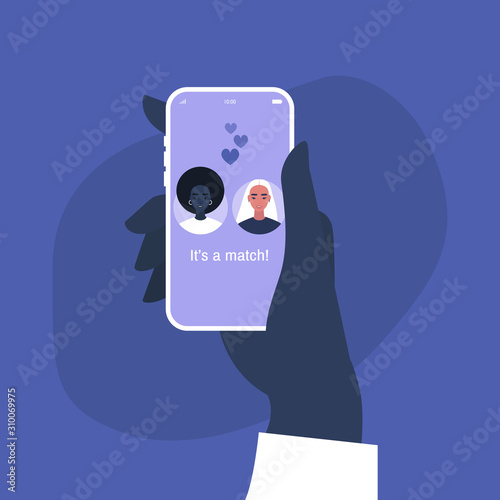 Hand holding a smart phone with a dating service mobile application on it, lesbian relationships