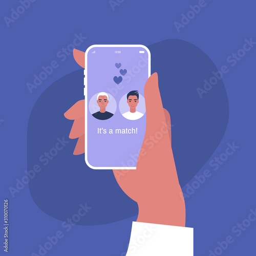 Hand holding a smart phone with a dating service mobile application on it, homosexual relationships
