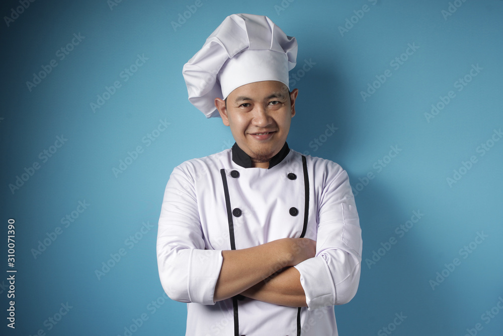 Happy Proud Asian Chef Smiling at Camera With Crossed Arms Happy Proud Asian Chef Smiling at Camera With Crossed Arms