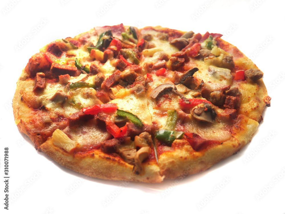 Pizza in round shape, topped with meat, ham, mushroom and veggies