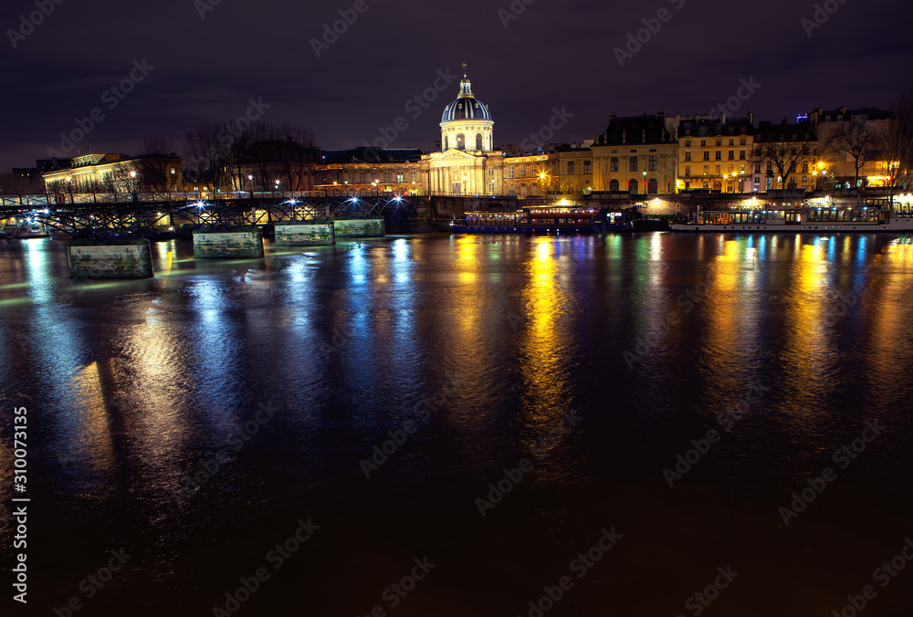 Night view of Invalides and Seine river in Paris