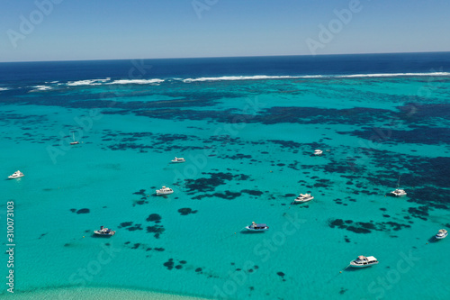 Boats and yachts moored off Coral Coast in Western Australia 