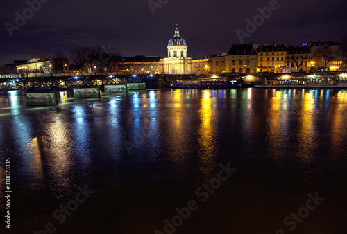 Night view of Invalides and Seine river in Paris