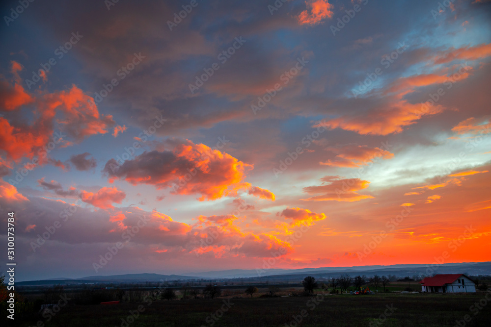 Fantastic clouds on the sky at the sunset