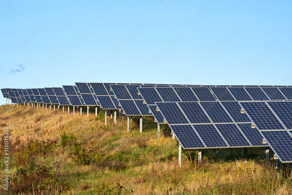 green energy. solar panel field in the winter sun. alternate energy. photovoltaic, blue sky, germany green energy. solar panel field in the winter sun. alternate energy. photovoltaic, blue sky, germany