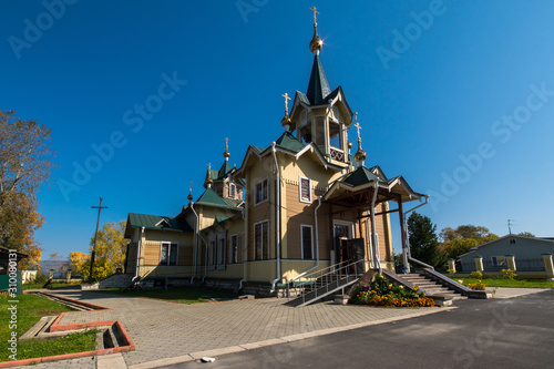 Wooden orthodox church in the Russian city photo