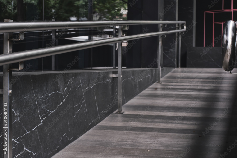 Fototapeta premium dark gray ramp with metal handles