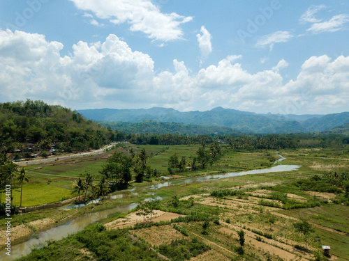 aerial view of village in a valley with nice field view under the mountains