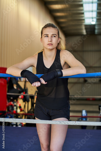 young female keeping fit boxing