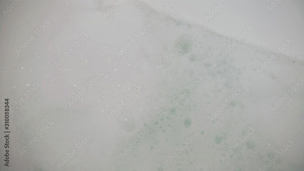Tub Being Filled with Warm Water and Bubble Bath Tub Being Filled with Warm Water and Bubble Bath