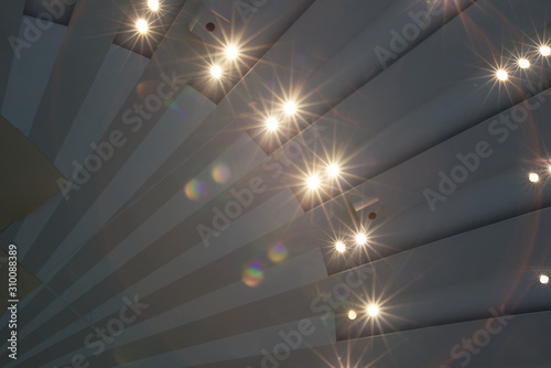 Ray like ceiling with light starburst photo