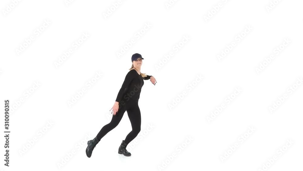Young female hip-hop dancer dressed in black, performing on a white background Young female hip-hop dancer dressed in black, performing on a white background