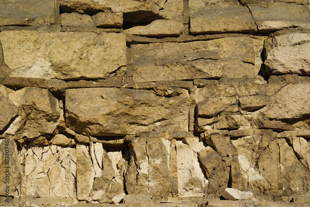 Fototapeta premium A brick wall broken by everyday life