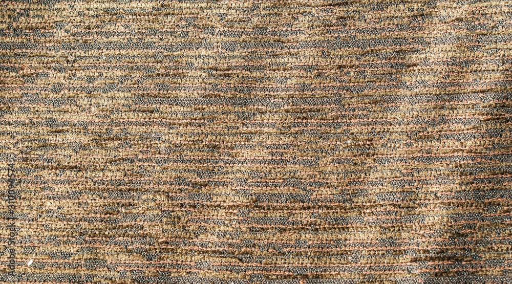 Textured surface brown fabric background under sunlight Textured surface brown fabric background under sunlight