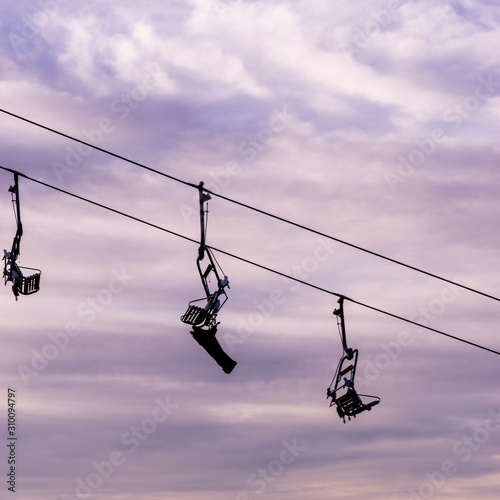 The lifts for which are going up and down the mountain