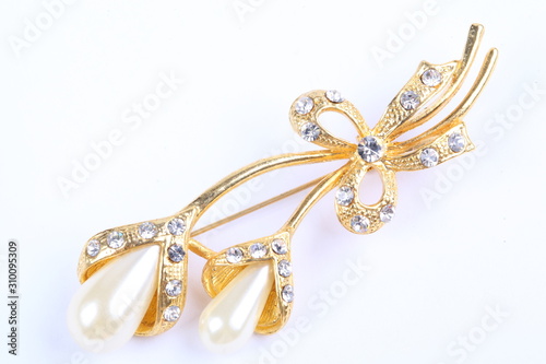 Flower brooch on white background