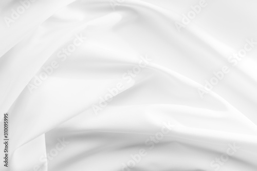 Abstract white fabric texture background. Cloth soft wave. Creases of satin, silk, and cotton. © Ekkachai