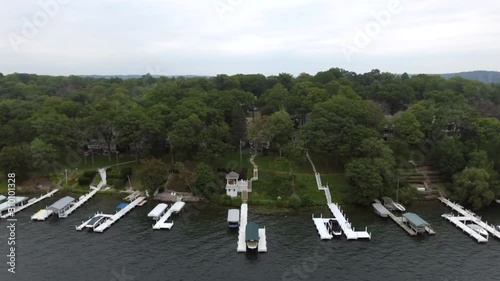 Backwards Flying Revealing the Lake behind the trees photo