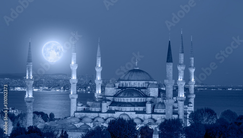 The Sultanahmet Mosque (Blue Mosque) with full moon - Istanbul, Turkey "Elements of this image furnished by NASA "