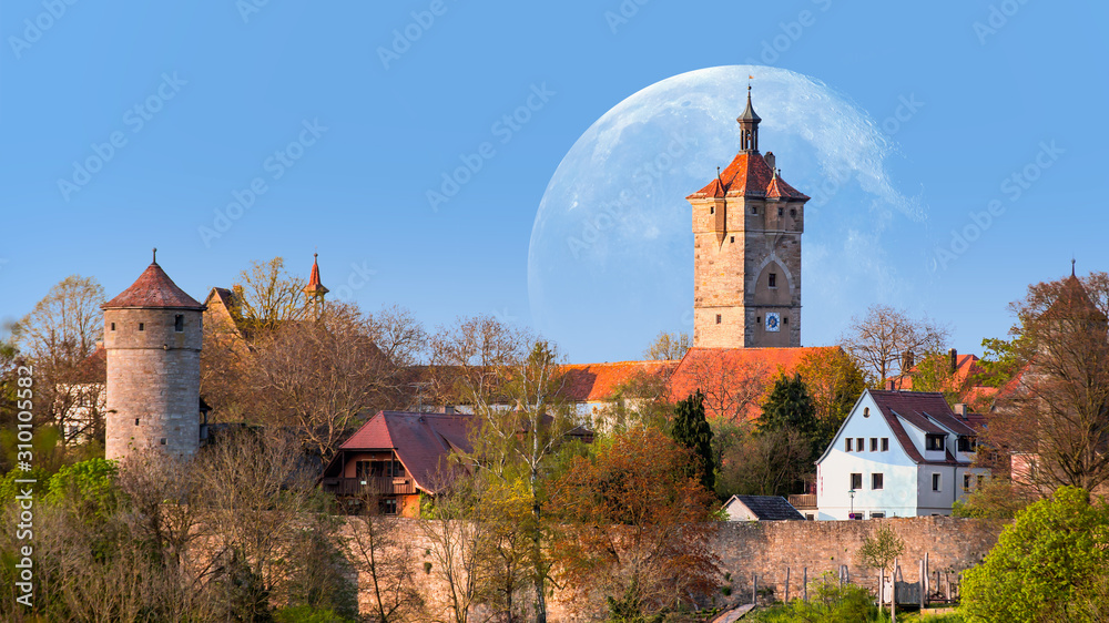 Historic town with full moon at Rothenburg Ob Der Tauber, Franconia, Bavaria, Germany 