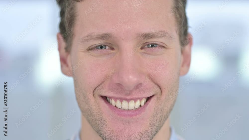 Close up of Face of Young Male Smiling at the Camera Close up of Face of Young Male Smiling at the Camera