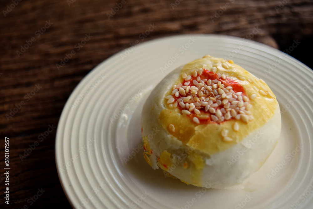 1 beautiful Chinese spring roll pastry, sprinkled with sesame seeds in a lovely white ceramic dish 1 beautiful Chinese spring roll pastry, sprinkled with sesame seeds in a lovely white ceramic dish