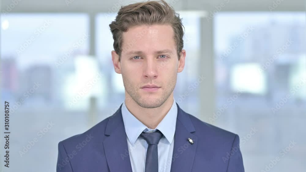 Portrait of Young Businessman Looking at the Camera Portrait of Young Businessman Looking at the Camera